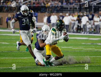 August 31, 2019: Norfolk State Spartans WR #15 Da'Kendall James is dragged down from behind by ODU Monarchs CB #11 Robert Scott during a NCAA football game between the Old Dominions Monarchs and the Norfolk State Spartans at S.B. Ballard Stadium in Norfolk, VA. Justin Cooper/CSM Stock Photo