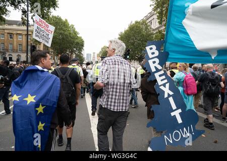 London, UK. 31st Aug, 2019. Pro-Brexit supporters mingle with Anti-Brexit supporters at Whitehall during the demonstrations.Thousands of people gathered across the country to protest against Boris Johnson proroguing Parliament. Credit: SOPA Images Limited/Alamy Live News Stock Photo