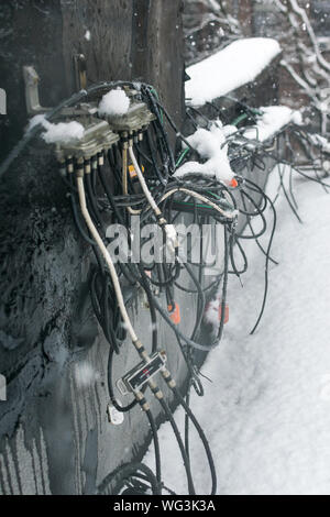 Huge mess of cables on a rooftop in Harlem, New York, USA Stock Photo