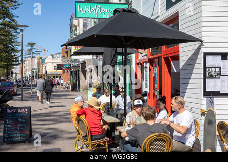 Australian cafe restaurant Hemingways in Manly beach Sydney with people enjoying coffee and breakfast lunch,Sydney,Australia Stock Photo