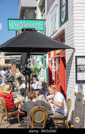 Australian cafe restaurant Hemingways in Manly beach Sydney with people enjoying coffee and breakfast lunch,Sydney,Australia Stock Photo