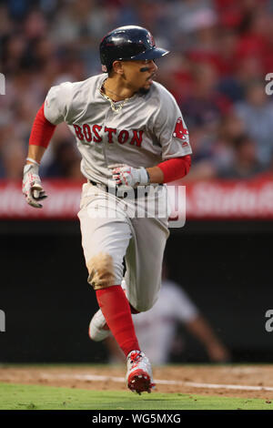 Anaheim, USA. 31st Aug, 2019. August 31, 2019: Boston Red Sox right fielder Mookie Betts (50) runs to first as he watches his hit during the game between the Boston Red Sox and the Los Angeles Angels of Anaheim at Angel Stadium in Anaheim, CA, (Photo by Peter Joneleit, Cal Sport Media) Credit: Cal Sport Media/Alamy Live News Stock Photo