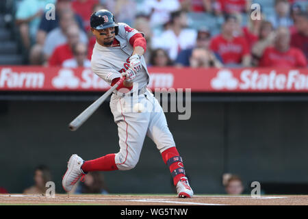 Anaheim, USA. 31st Aug, 2019. August 31, 2019: Boston Red Sox right fielder Mookie Betts (50) singles to open the game between the Boston Red Sox and the Los Angeles Angels of Anaheim at Angel Stadium in Anaheim, CA, (Photo by Peter Joneleit, Cal Sport Media) Credit: Cal Sport Media/Alamy Live News Stock Photo