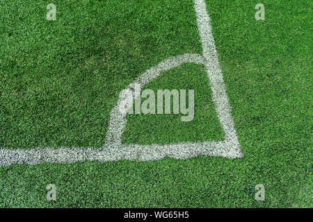 Photo of the details of football field with artificial grass. Stock Photo