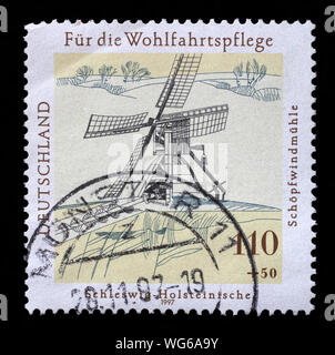 Stamp printed in Germany shows Welfare: Water and Windmills, circa 1997. Stock Photo