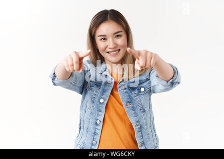 You best. Cheerful pretty outgoing young proud asian girl pointing camera index fingers picking person play her team smiling broadly feel enthusiastic Stock Photo