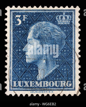 Stamp issued in Luxembourg shows Grand Duchess Charlotte circa 1951. Stock Photo