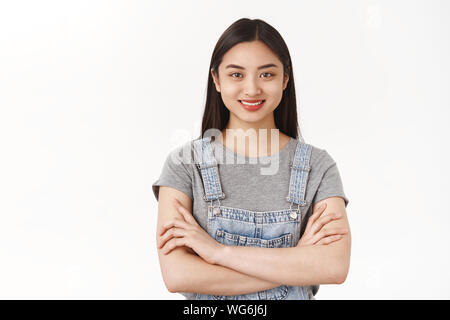 Girl feels like pro. Attractive self-assured asian woman freelance student hold arms crossed body smiling determined motivated receive first prize Stock Photo