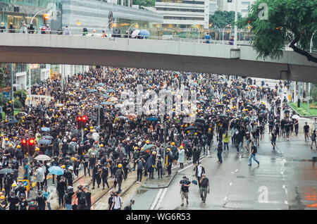 Hong Kong, 31 Aug 2019 - Hong Kong protest crowd as black bloc in Admiralty Stock Photo