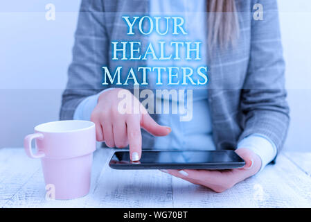 Handwriting text writing Your Health Matters. Conceptual photo good health is most important among other things Business woman sitting with mobile pho Stock Photo