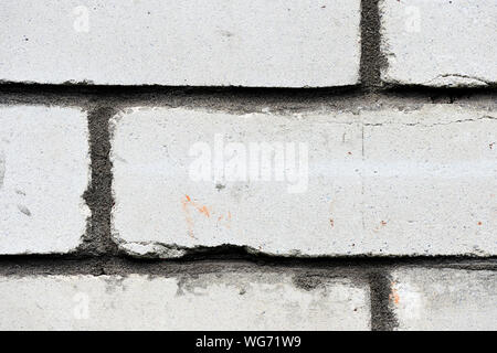 Gray brick wall close up. Abstract background Stock Photo