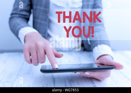 Word writing text Thank You. Business photo showcasing polite expression used when acknowledging gift service compliment Business concept with mobile Stock Photo