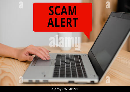 Text sign showing Scam Alert. Business photo showcasing unsolicited email that claims the prospect of a bargain woman laptop computer smartphone mug o Stock Photo