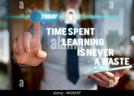 Writing note showing Time Spent Learning Is Never A Waste. Business concept for education has no end Keep learning Modern technology Lady front presen Stock Photo