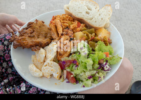 A turkish lunch served on a white plate with bread Stock Photo