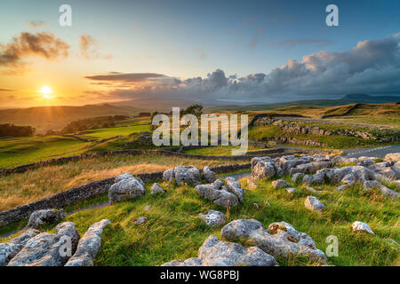 Dramatic sunset over beautiful scenery at the Winskill Stones near Settle in the Yorkshire Dales Stock Photo