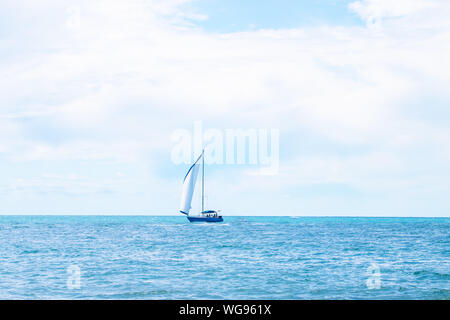 Sailing. Yachting. Tourism. Luxury Lifestyle. Ship yachts with white sails in the open sea. Stock Photo