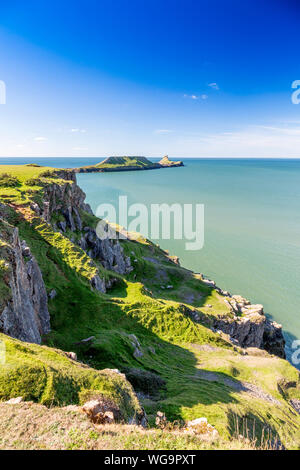 The coastline between Rhossili and Worms Head on the Gower peninsula is composed of steep carboniferous limestone cliffs,  South Wales, UK Stock Photo