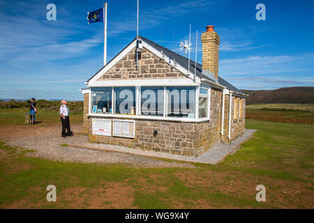 The National Coastwatch Institution lookout at Worms Head on the Gower peninsula, South Wales, UK Stock Photo