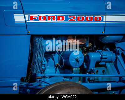 Engine of Ford 2000 vintage tractor painted blue with red and white lettering Stock Photo