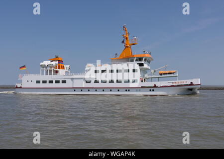 The passenger ship Langeoog IV arrives on June 23, 2019 the port of Bensersiel. Stock Photo