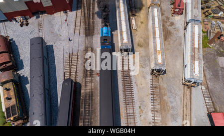 Aerial View of Train Yard Waiting for Thomas the Train Puffing Smoke on a Sunny Summer Day Stock Photo