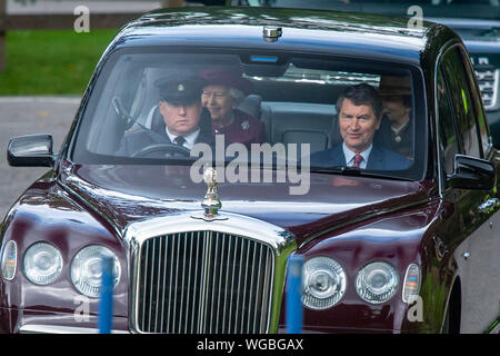 Queen Elizabeth II (back left) and the Princess Royal (back right) arrive at Crathie Kirk in Scotland for a Sunday morning church service. Stock Photo