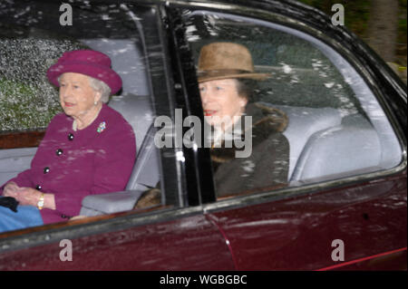 Queen Elizabeth II and the Princess Royal leave Crathie Kirk in Scotland after attending a Sunday morning church service. Stock Photo