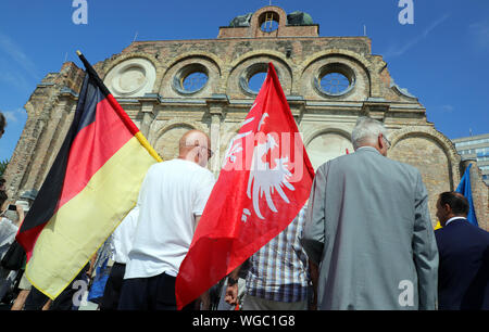 Berlin, Germany. 01st Sep, 2019. People take part in a memorial service of the German Poland Institute on the occasion of the 80th anniversary of the attack of German troops on Poland in front of the ruins of the Anhalter railway station. The German invasion of Poland on 1 September 1939 marked the beginning of the Second World War. Credit: Wolfgang Kumm/dpa/Alamy Live News Stock Photo