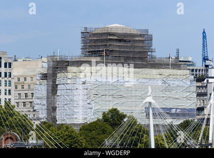 Shell Mex House, as Grade II listed building from across the Thames undergoing refurbishment, restoration, renovation. In London, England, UK. Stock Photo