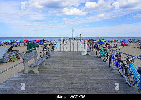 OCEAN GROVE, NJ -10 AUG 2019- View of the boardwalk along the beach in Ocean Grove, a town on the New Jersey Shore, known for its historic Victorian h Stock Photo