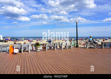 OCEAN GROVE, NJ -10 AUG 2019- View of the boardwalk along the beach in Ocean Grove, a town on the New Jersey Shore, known for its historic Victorian h Stock Photo