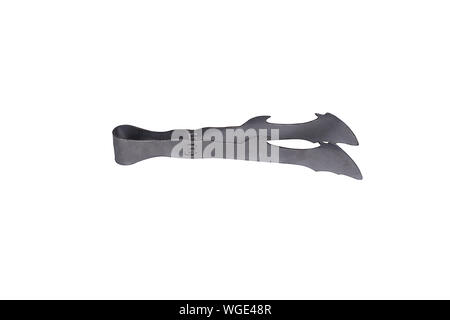 Old patterned toothed aluminum trigger for grilles and burning fire Stock Photo