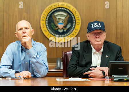 Thurmont, USA. 31st Aug, 2019. President Donald J. Trump, joined by U.S. Senator Rick Scott, R-Fla., receives a Federal Emergency Management Agency (FEMA) briefing update on Hurricane Dorian as it approaches the U.S. mainland Saturday, Aug. 31, 2019, at Camp David near Thurmont, Md. People: President Donald J. Trump, U.S. Senator Rick Scott, Credit: Storms Media Group/Alamy Live News Stock Photo