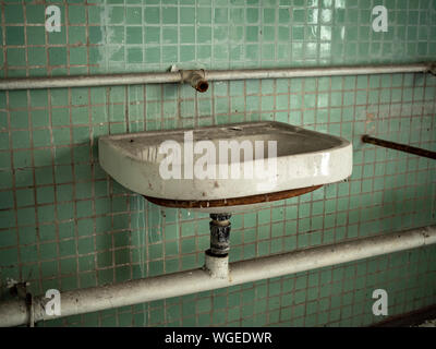 Old sink inside of an abandoned military building in Chernobyl-2 city in Chernobyl Exclusion Zone, Ukraine Stock Photo