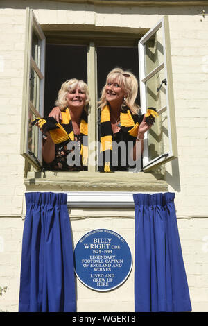 Ironbridge, Shropshire, UK 1st September 2019. Vicky and Babette the daughters of English footballing legend Billy Wright unveil a plaque on the house in New Road, Ironbridge where Billy lived as a child. Billy played all his career at Wolverhampton Wanderers and was the first player in the world to play more 100 games for his country when got 105 caps for England. He married Joy Beverley of The Beverly Sisters in 1958 and they became the golden couple of the 1950s. Credit: David Bagnall/Alamy Live News Stock Photo