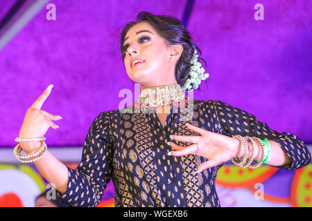 London, UK. 1st Sep 2019. The Dancing Divas Group from West London perform some elegant traditional dancing at the London Mela, a festival showcasing Asian culture, dance, music and food in Southall Park, London. Credit: Imageplotter/Alamy Live News Stock Photo