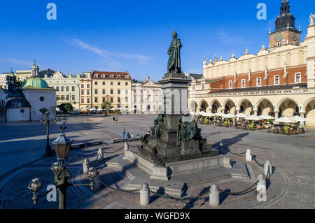 Bronze statue of Adam Mickiewicz, Polish national romantic poet and dramatist on Main Market Square in Krakow, Poland. Monument unveiled in 1898. St. Stock Photo