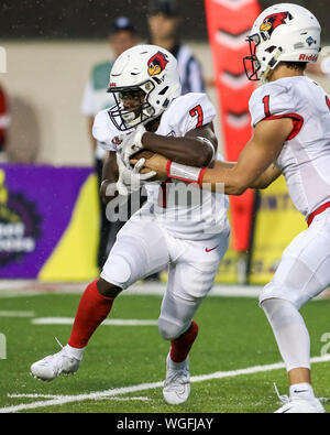 Saturday Aug 31st- Illinois State Redbirds running back Jeffrey Proctor (7) takes a handoff from Illinois State Redbirds quarterback Brady Davis (1) during NCAA football game action between the Northern Illinois Huskies vs the Illinois State University Redbirds at Huskie Stadium in DeKalb, IL Stock Photo