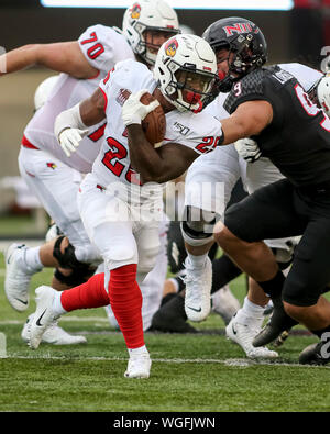 Saturday Aug 31st- Illinois State Redbirds running back James Robinson (25) fends off a tackle attempt by Huskies defensive end Matt Lorbeck (9) during NCAA football game action between the Northern Illinois Huskies vs the Illinois State University Redbirds at Huskie Stadium in DeKalb, IL Stock Photo