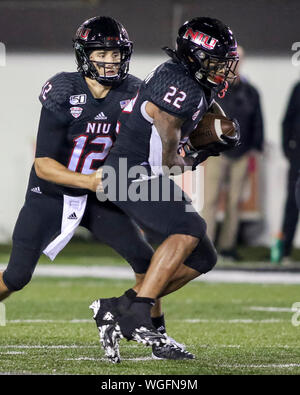 Saturday Aug 31st- Huskies running back Tre Harbison (22) takes the hand off from Huskies quarterback Ross Bowers (12) during NCAA football game action between the Northern Illinois Huskies vs the Illinois State University Redbirds at Huskie Stadium in DeKalb, IL Stock Photo