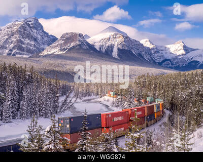 Train on Morant's Curve on January 15, 2017 iin Banff National Park, Alberta, Canada. Morant's Curve is a scenic spot 4 kilometers east of Lake Louise Stock Photo