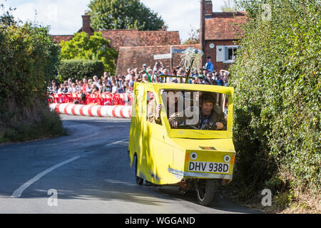 Cookham Dean, UK. 1 September, 2019. A custom-built kart in the form of Trotter's Independent Trading Reliant Regal van from the TV series 'Only Fools and Horses' competes in the Cookham Dean Gravity Grand Prix in aid of the Thames Valley and Chiltern Air Ambulance. Credit: Mark Kerrison/Alamy Live News Stock Photo