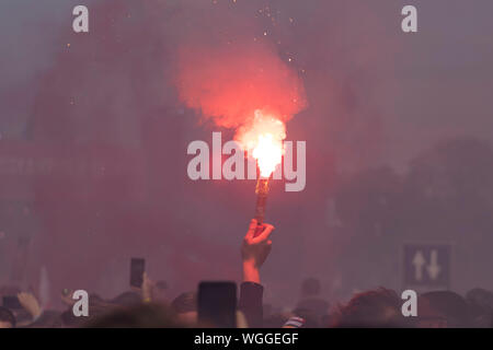 Fire torch from a football supporter Stock Photo