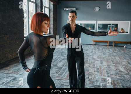 Dancers in costumes on ballrom dance training Stock Photo