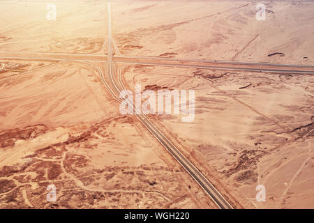aerial view of highway road in desert Stock Photo