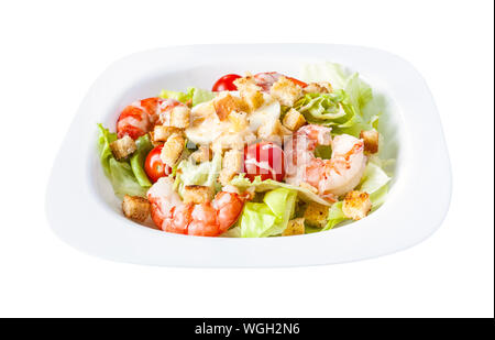 Caesar salad with prawns on white plate isolated on white background Stock Photo