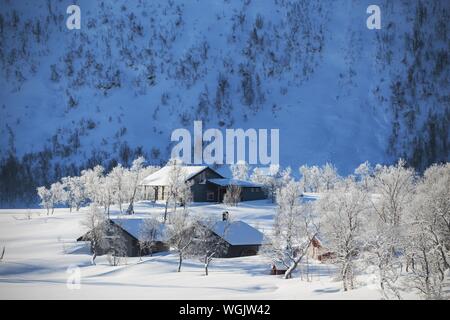 traditional norwegian wooden house and mountains in the distance. Norway. world travel Stock Photo