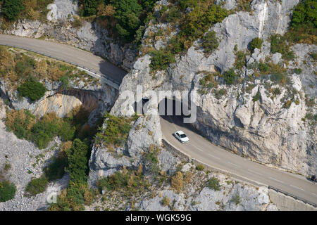 AERIAL VIEW. Picturesque road on a cliff between Gréolières village and the ski resort of Gréolières-les-Neiges. Alpes-Maritimes, France. Stock Photo