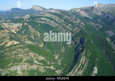 AERIAL VIEW. Velodrome of Esclangon; a semicircular sandstone cliff. La Robine-sur-Galabre, Unesco Geopark of Haute-Provence, France. Stock Photo